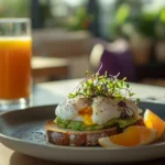 Plate of air fryer poached eggs on toast with a bright breakfast setup.