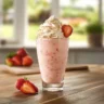 Homemade Strawberry Piña Colada with Malibu Frosting on a kitchen counter